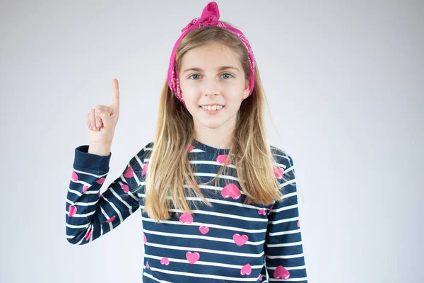 Little Girl Showing Pointing Finger Number One While Smiling Confident — Stock Photo, Image