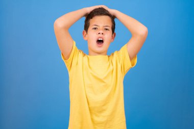 Surprised child isolated on a over blue background