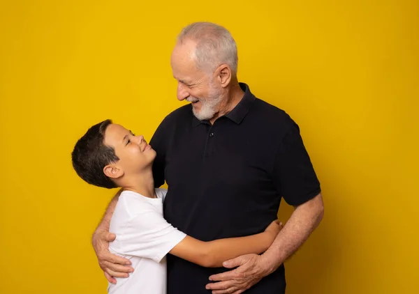 Grandfather Grandson Smiling Yellow Background — Stock fotografie