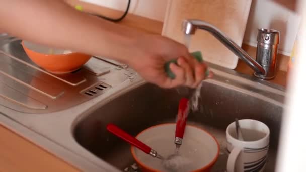 Man washes dishes in the kitchen — Stock Video