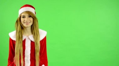 Christmas - Holidays - young attractive woman - green screen - woman smiles (happy)