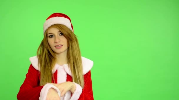 Christmas - Holidays - young attractive woman - green screen - woman shows at time (late) — Stock Video