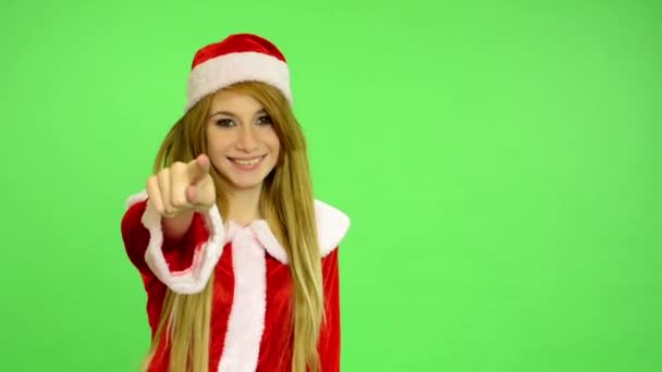 Christmas - Holidays - young attractive woman - green screen - woman chooses people and invites them to her — Stock Video