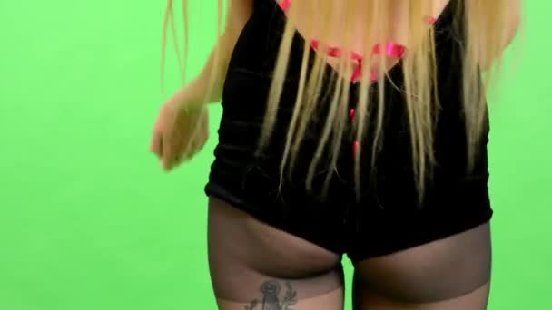 Young erotic woman dancing - green screen - sexy flirting model - studio - dance - detail the bottom — Stock Video