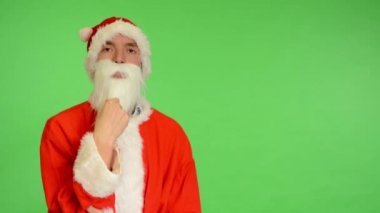 Noel Baba - yeşil ekran - studio - Noel Baba düşünme ve sakalını vuruş