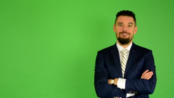 Business man smiles - green screen - studio — Stock Video