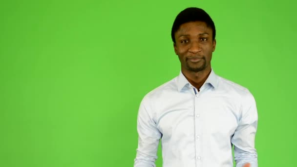 Young handsome black man talk - green screen - studio — Stock Video