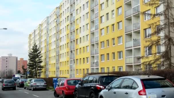 Housing estate (high rise block of flats) with nature and car park - people — Stock Video