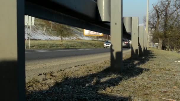 Road with cars - guardrail - buildings — Stock Video