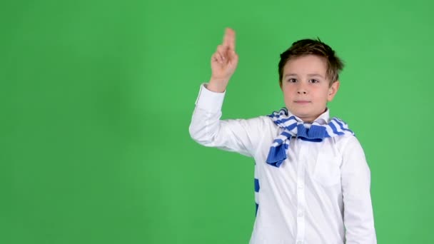 Young handsome child boy raise (hold up) - green screen - studio — Stock Video
