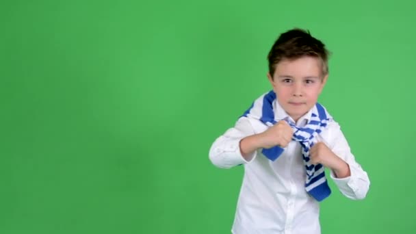 Young handsome child boy doing fighting grimaces - green screen - studio — Stock Video