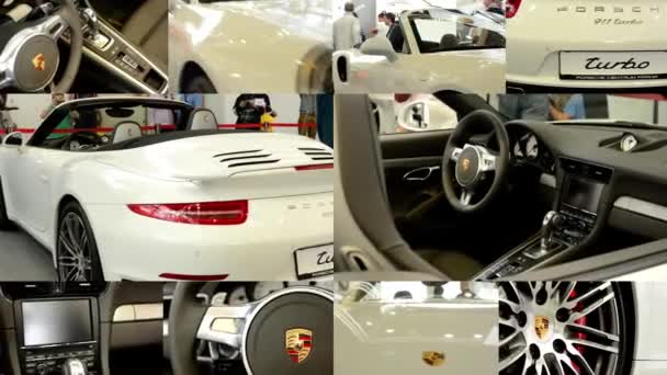 PRAGA, REPÚBLICA CHECA, EXPOSICIÓN DE COCHES - 27 DE SEPTIEMBRE DE 2014: Montaje 4K (compilación) - Porsche 911 turbo cabrio car (exterior e interior) - personas en exposición — Vídeo de stock