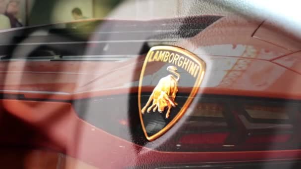 PRAGUE, CZECH REPUBLIC, CAR EXHIBITION - SEPTEMBER 27, 2014: detail of logo (wheel) - Lamborghini (interior) - backlight and side of car (mirror)- luxury fast car - Lamborghini - Aventador — Stock Video