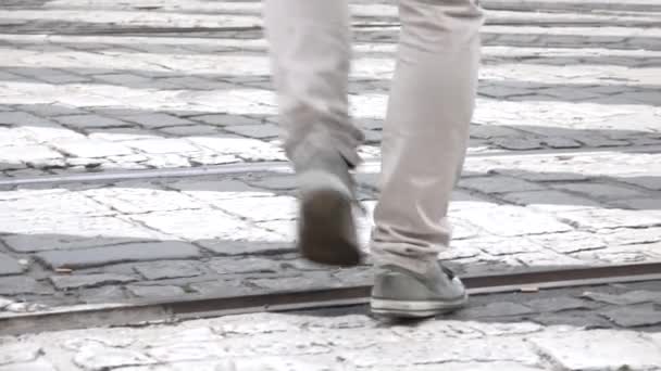 Young man go across the road - pedestrian crossing - closeup legs — Stock Video