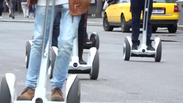 PRAGUE, CZECH REPUBLIC - MAY 30, 2015: people travel on segway - urban street in the city-  closeup legs — Stock Video