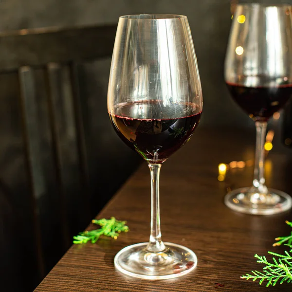 red wine in a glass festive christmas holidays party new year meal on the table tasty serving size top view copy space for text food background rustic