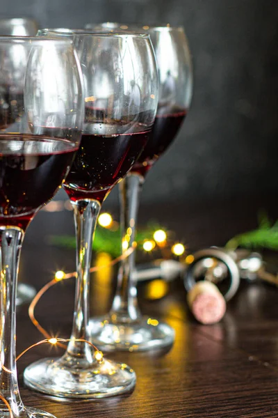 red wine in a glass festive christmas holidays party new year meal on the table tasty serving size top view copy space for text food background rustic