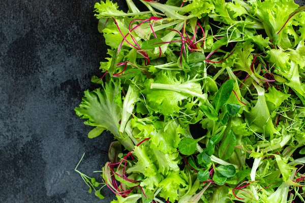 Healthy salad, leaves mix salad mix micro greens, juicy snack. food background top Image