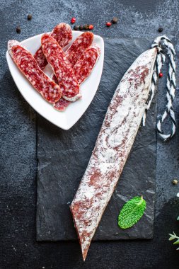 sausage fuet smoked dry-cured salami meat on the table meal snack outdoor top view copy space for text food background rustic image clipart