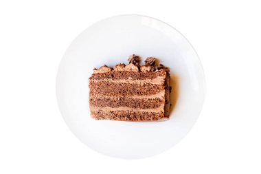 Beyaz bir tabakta hazır çikolatalı kek kremalı tatlı. Sağlıklı yemek için hazır. Üst görünüm için fotokopi alanı.