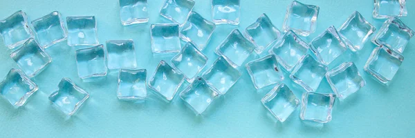 imitation artificial ice cubes plastic pieces transparent acrylic not really cold, optical illusion ready to eat on the table outdoor top view copy space for text food background