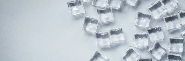 ice cube pieces not real coldimitation artificial plastic transparent acrylic , illusion ready to eat on the table outdoor top view copy space for text food background