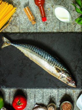 herring fish top view with ingredients for preparation 