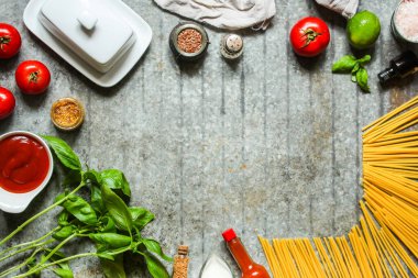 top view ingredients for pasta, spices, herbs, vegetables
