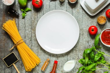 top view ingredients for pasta, spices, herbs, vegetables