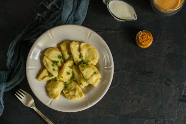 delicious homemade dumplings with sauce on table, top view