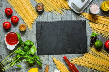 top view ingredients for pasta, spices, herbs, vegetables