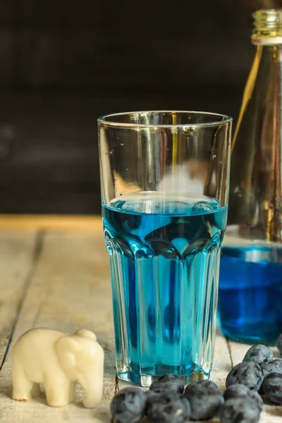 blue water in glass close up