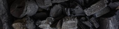 Kara kömür arka planı. Kara odun kömürü. Bir sürü odun.