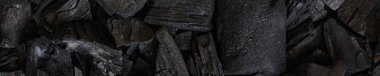 Kara kömür arka planı. Kara odun kömürü. Bir sürü odun.