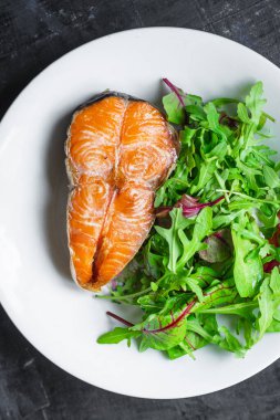 salmon fried and salad grilled fish BBQ seafood barbecue snack pescetarian diet vegetarian food trend meal copy space food background rustic. top view 