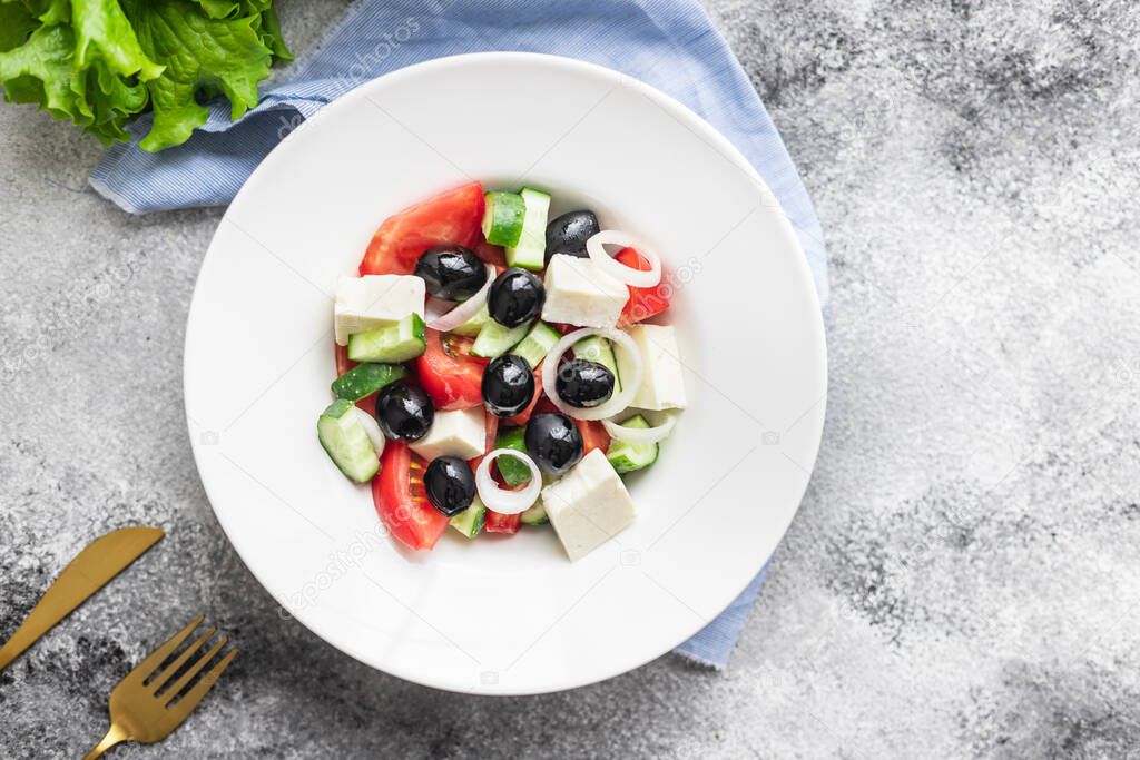 fresh greek salad vegetable, olives, tomato, cucumber, olive oil traditional recipe organic dish on the table healthy food meal snack copy space food background rustic. top view keto or paleo diet
