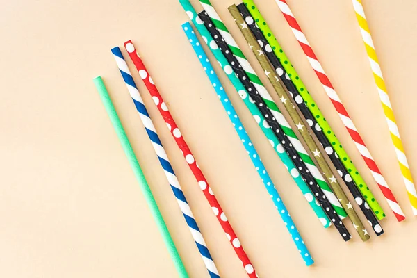 paper straws multicolored striped dotted straws scattered Flat lay useful ecology cocktail or juice, lemonade to usebiodegradable on the table concept party healthy meal copy space food background