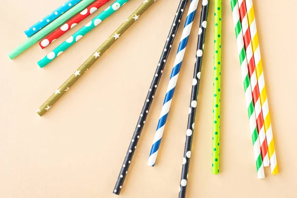 paper straws multicolored striped dotted straws scattered Flat lay useful ecology cocktail or juice, lemonade to usebiodegradable on the table concept party healthy meal copy space food background