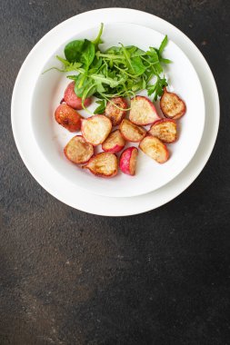 radish fried recipe vegetable diet veggie vegan or vegetarian food on the table healthy food meal snack keto or paleo diet copy space food background rustic top view 