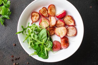radish fried recipe vegetable diet veggie vegan or vegetarian food on the table healthy food meal snack keto or paleo diet copy space food background rustic top view 