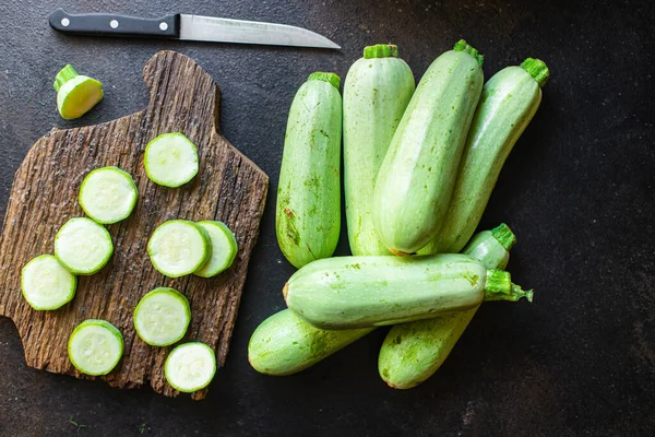 zucchini fresh vegetables Cooking harvest organic farm products on the table, healthy food meal copy space food background rustic. top view keto or paleo diet veggie vegan or vegetarian