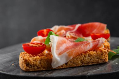 jamon bruschetta prosciutto appetizer portioned tapas dish natural tasty snack fresh delicious gourmet food background on the table rustic top view copy space
