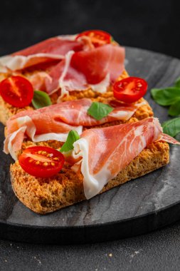 jamon bruschetta prosciutto appetizer portioned tapas dish natural tasty snack fresh delicious gourmet food background on the table rustic top view copy space