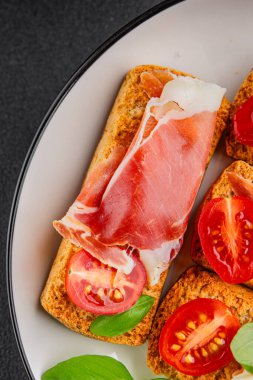 jamon bruschetta prosciutto appetizer portioned tapas dish natural tasty snack fresh delicious gourmet food background on the table rustic top view copy space