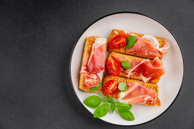 jamon bruschetta prosciutto appetizer portioned tapas dish natural tasty snack fresh delicious gourmet food background on the table rustic top view copy space