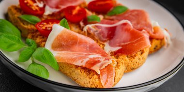 jamon bruschetta prosciutto appetizer portioned tapas dish natural tasty snack fresh delicious gourmet food background on the table rustic top view copy space