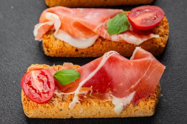 jamon bruschetta prosciutto appetizer portioned tapas dish natural tasty snack fresh delicious gourmet food background on the table rustic top view copy space