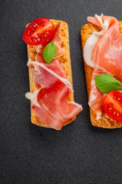 jamon bruschetta prosciutto appetizer portioned tapas dish natural tasty snack fresh delicious gourmet food background on the table rustic top view copy space