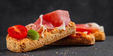 jamon bruschetta prosciutto appetizer portioned tapas dish natural tasty snack fresh delicious gourmet food background on the table rustic top view copy space