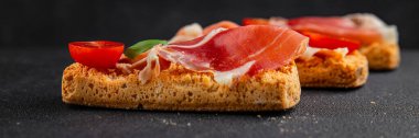 jamon bruschetta prosciutto appetizer portioned tapas dish natural tasty snack fresh delicious gourmet food background on the table rustic top view copy space